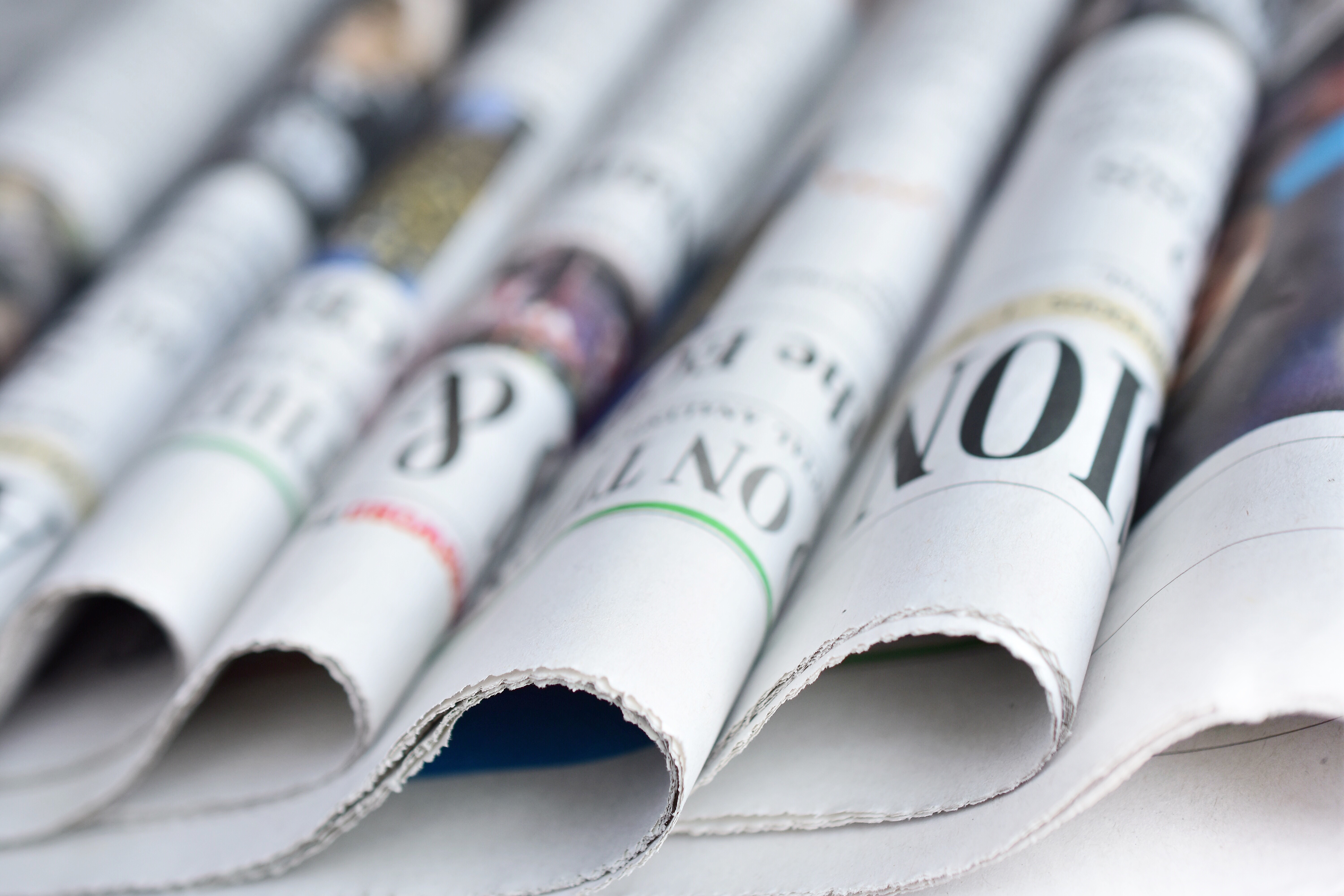 Stacks of freshly printed local newspapers