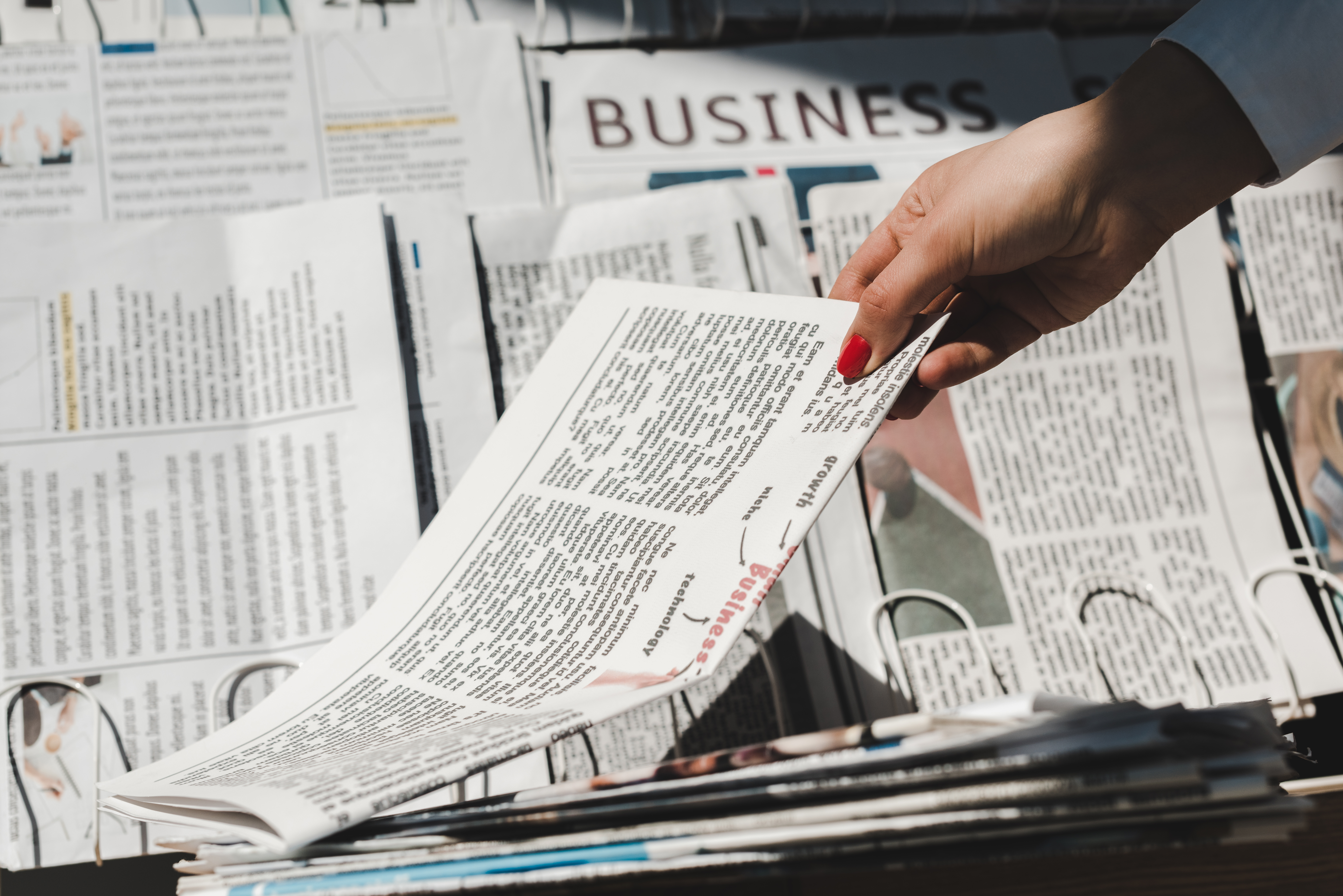 Reader picking up the daily print